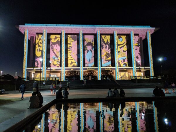 National Library of Australia with projection of colourful cartoon-like images on the facade
